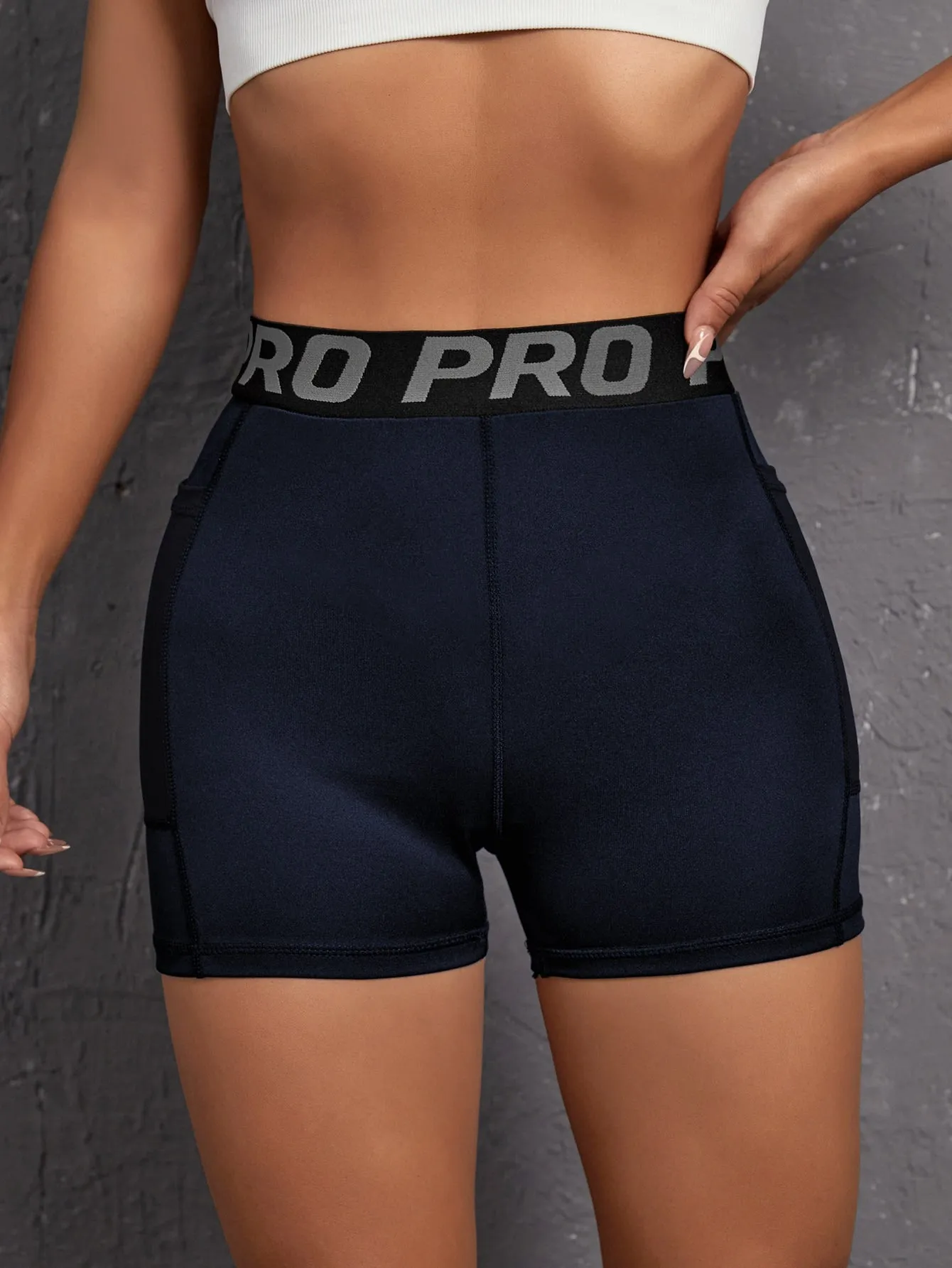 Letter Tape Waist Sports Shorts With Phone Pocket